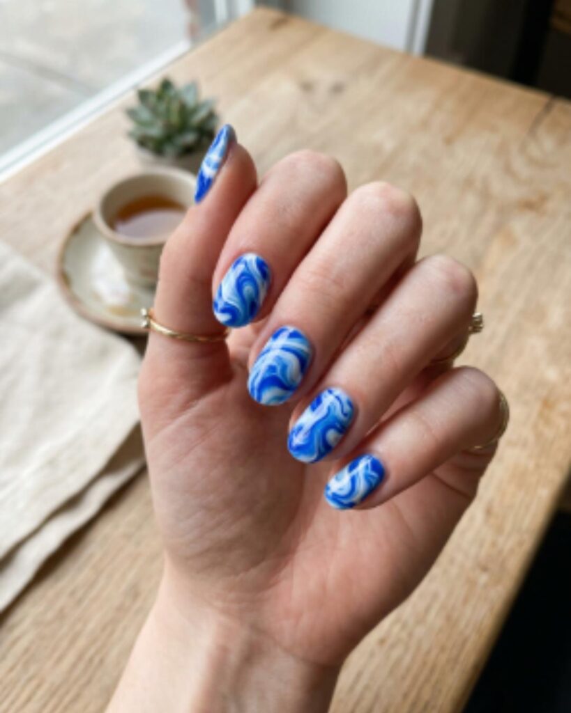 Blue and White Swirl Nails