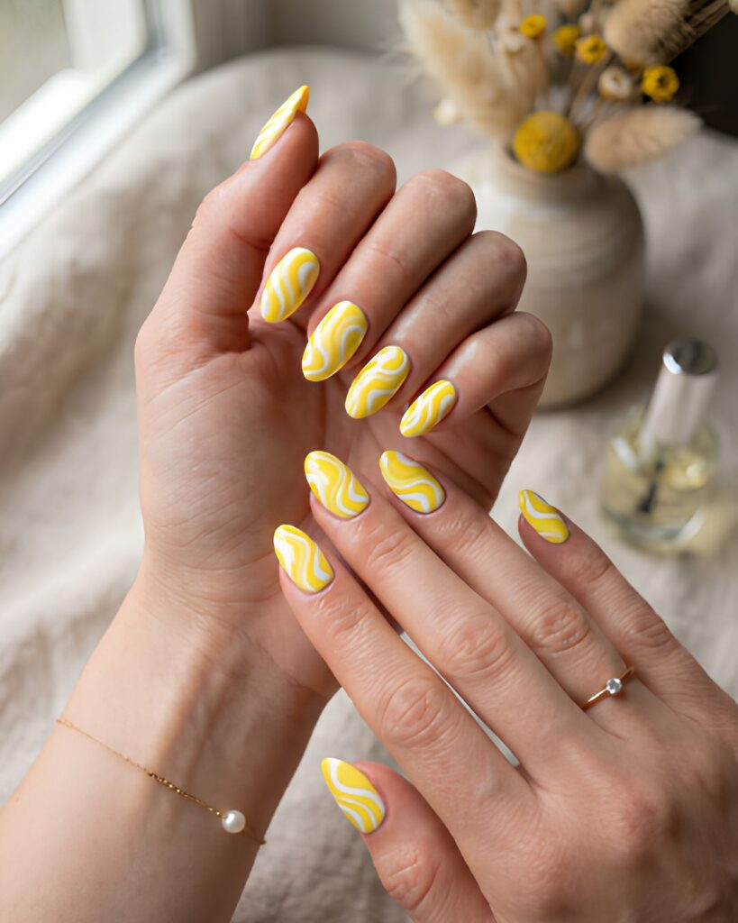 Yellow and White Swirl Nails