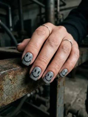 Smiley face grunge nails